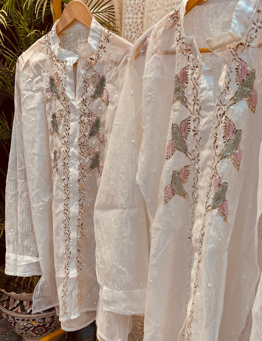Nazaqat Noor-e-Safed — Regal White Mul Designer Cord Set Adorned with Pink & Green Cut Dana Majesty